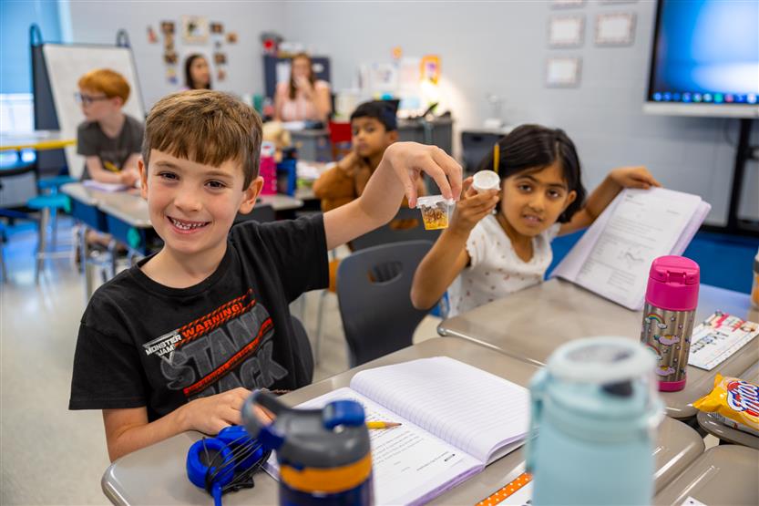 Students smile in science class